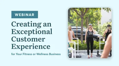 Woman leading outdoor fitness class