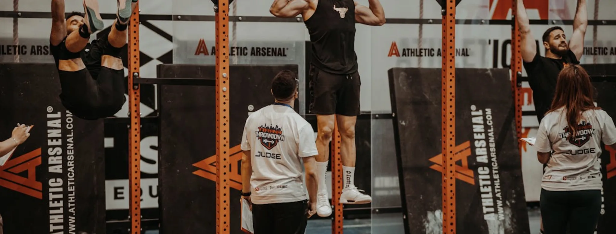 People doing pull ups at the gym