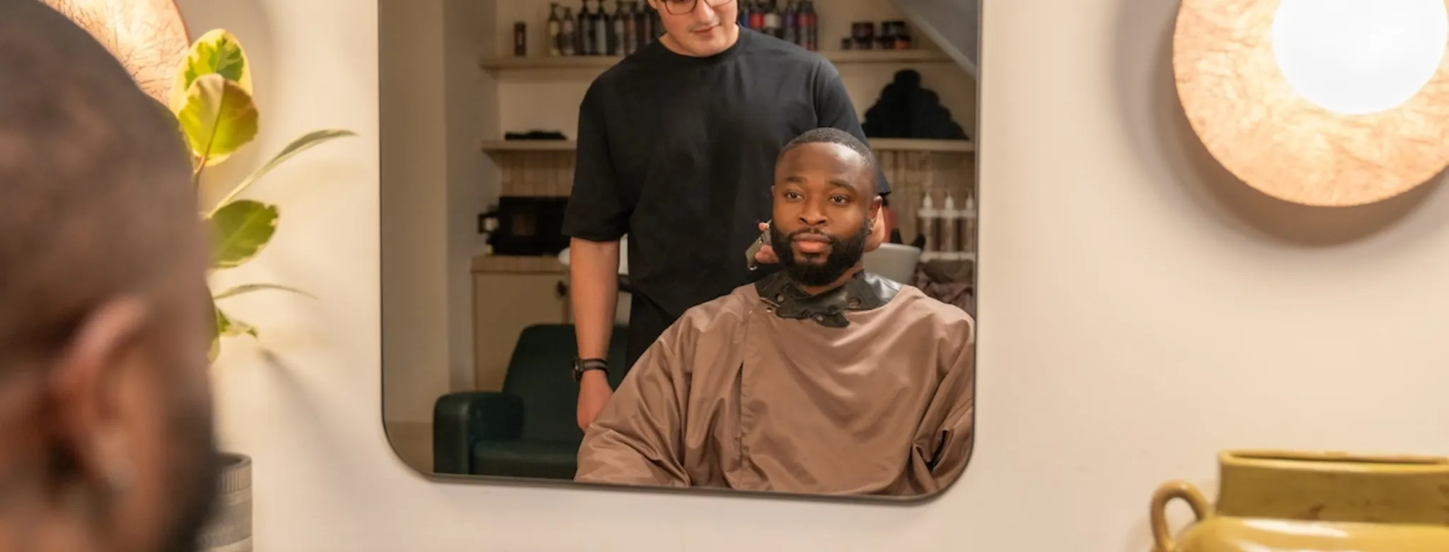 A man getting a haircut at the barbershop