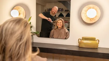 A woman getting her hair done at the salon