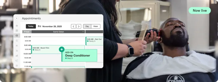 Man in barbershop using Mindbody appointments