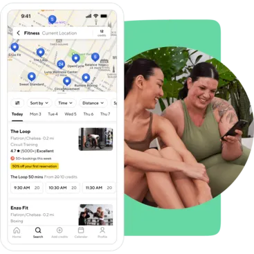 two women looking at the ClassPass app