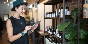 Person checking inventory on tablet
