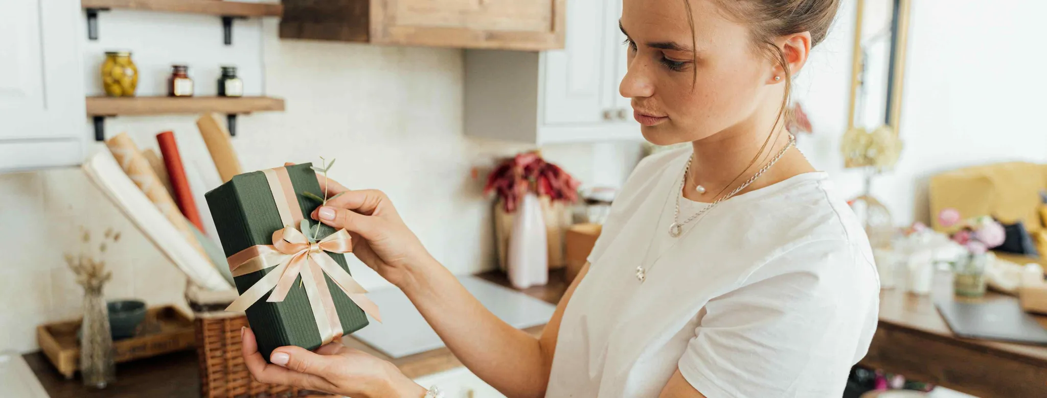 business owner preparing for the holidays and wrapping gifts