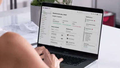 A laptop showing Mindbody reporting tools
