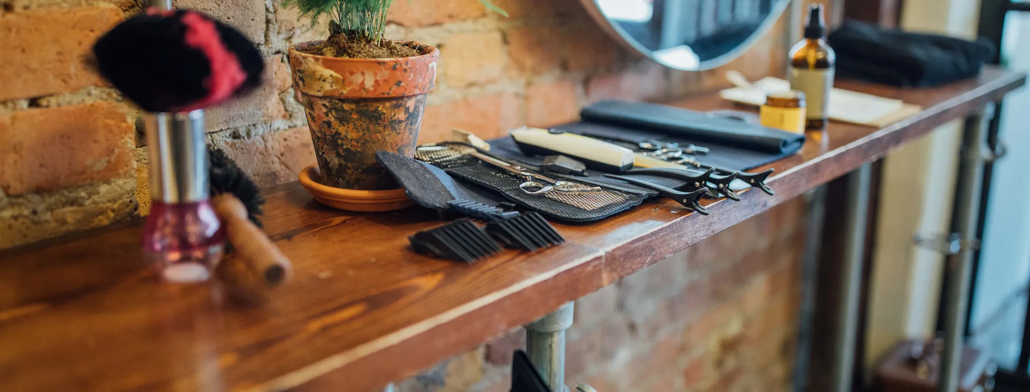 table at salon with salon tools plant and hair dryer