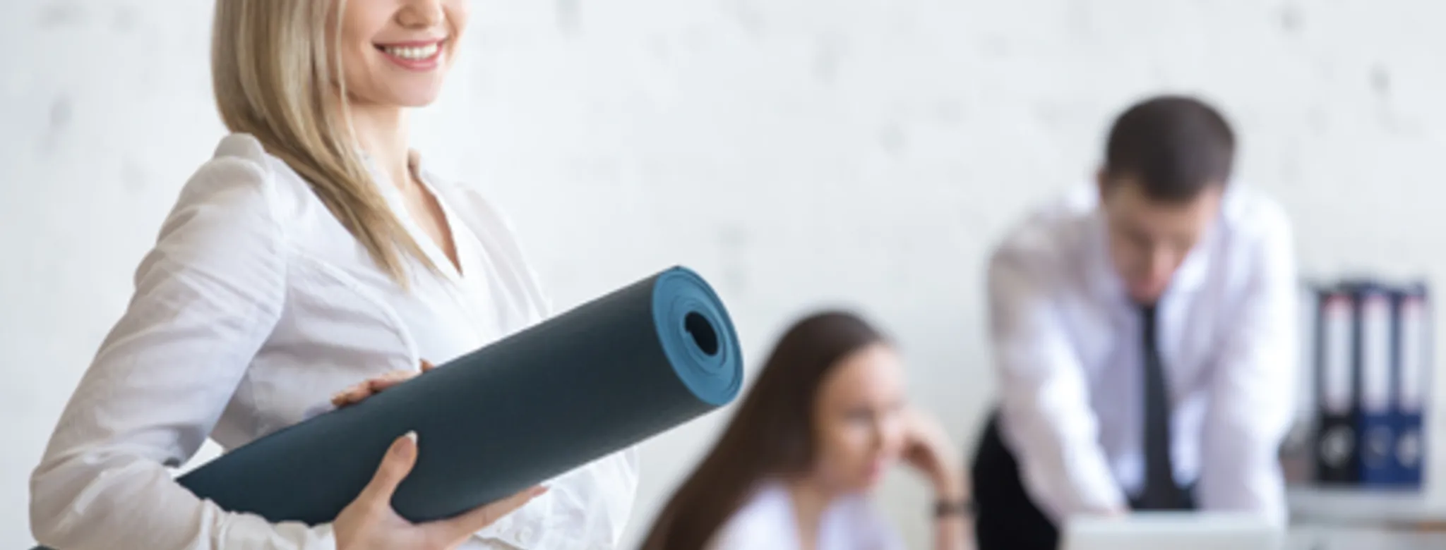 Fitness entrepreneur woman holding a yoga mat getting business financing