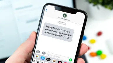 iPhone with text message with offer from wellness business