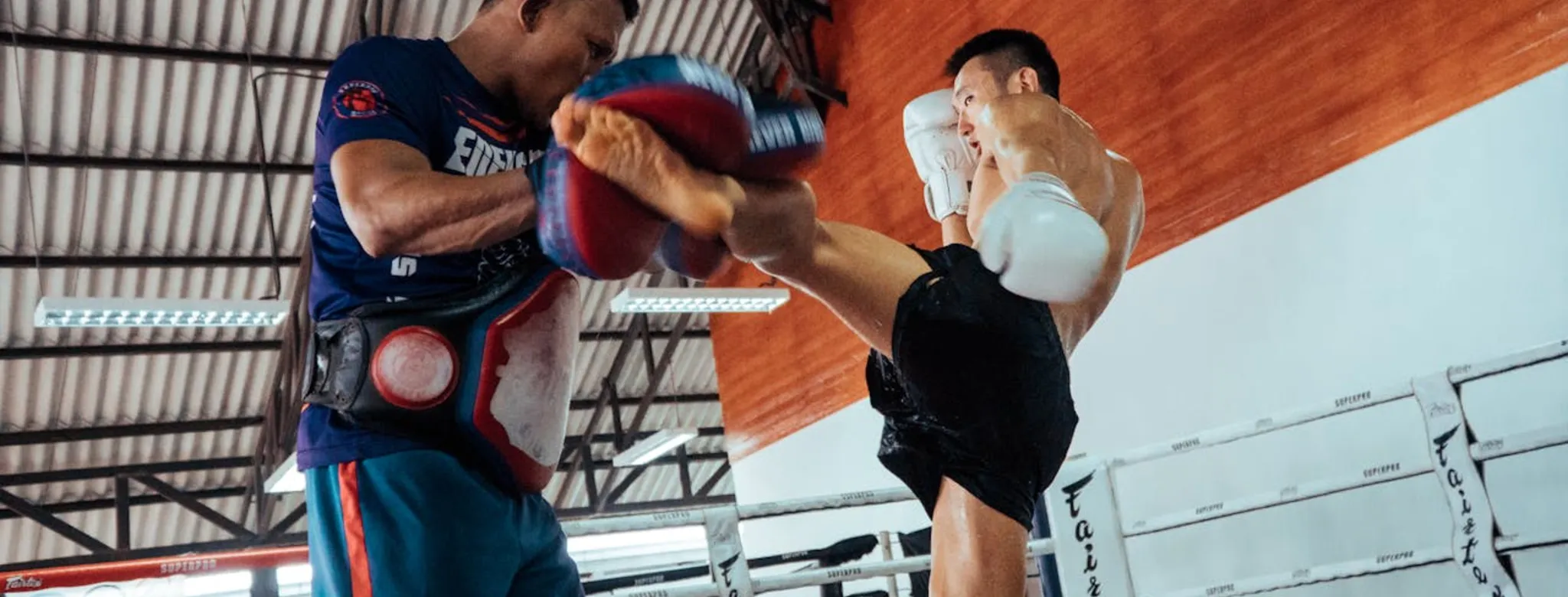Two men practicing martial arts.
